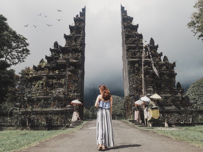 Woman Standing at the middle of Bali Handara Gate