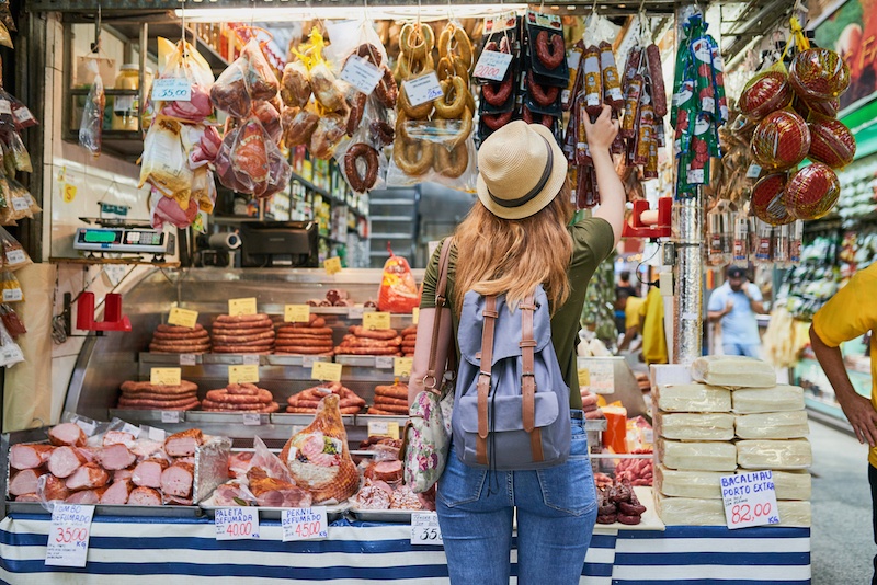 woman in front of market stall in brazil