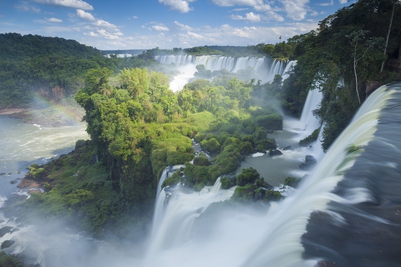 The Iguazu Falls sit on the border of Argentina and Brazil. 