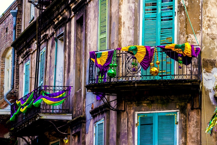 A building located in the French Quarter of New Orleans decorated for Mardi Gras.
