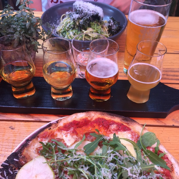 Beer tasting tray and delicious food at Hallertau