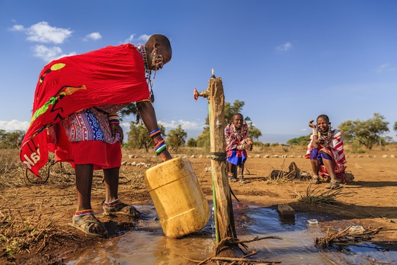 Masai women in Kenya filling water