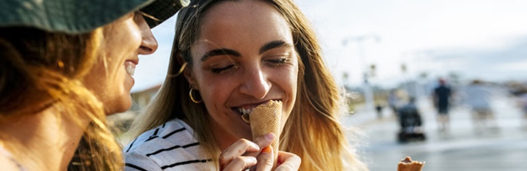Two women sharing an ice-cream