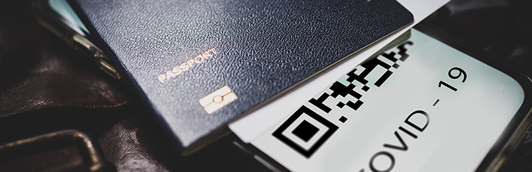 A passport and a Covid-19 QR code alongside