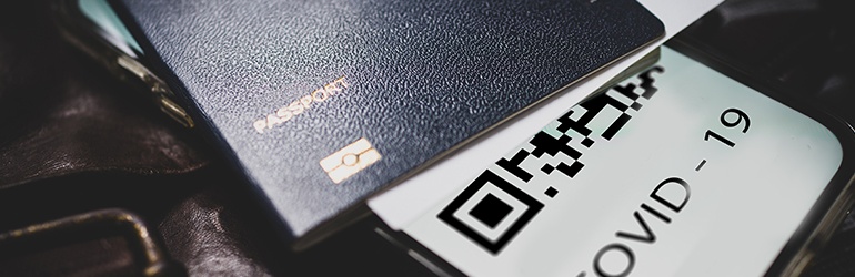 A passport and a Covid-19 QR code alongside 