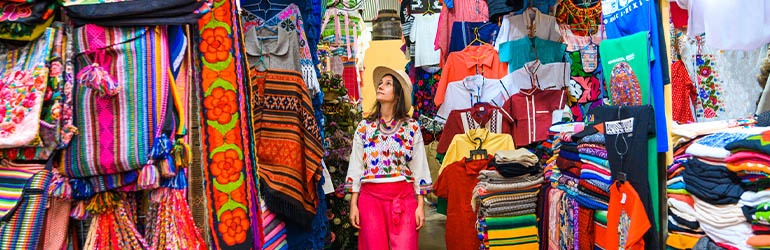 A lady walking through a market in Cancun