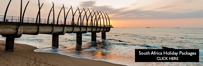 A view of Umhlanga's promenade pier along the South African coastline, which can be visited with a cheap South Africa holiday package from Flight Centre